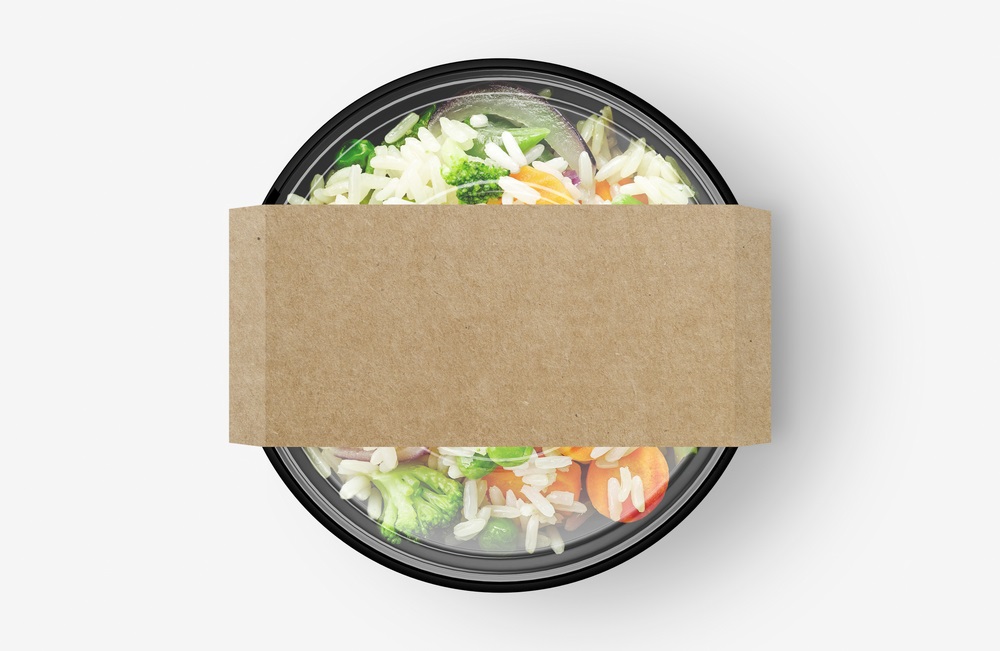 Various types of corporate lunch boxes neatly arranged with diverse food options.