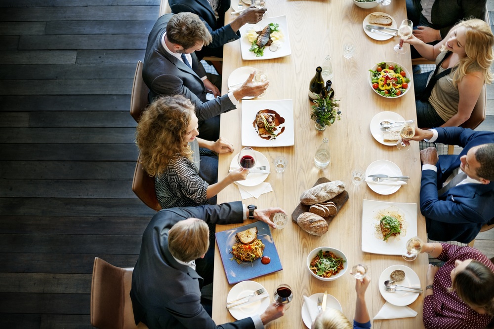 Holiday luncheon ideas for work setup with festive decorations and catering service.