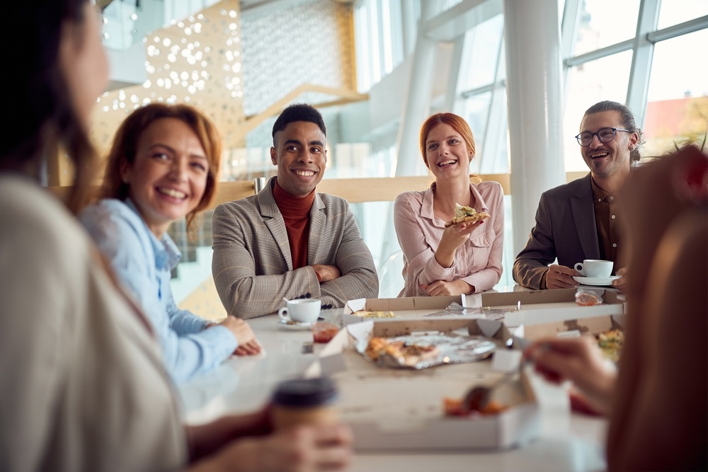 A team enjoying a variety of healthy, catered staff lunch options.